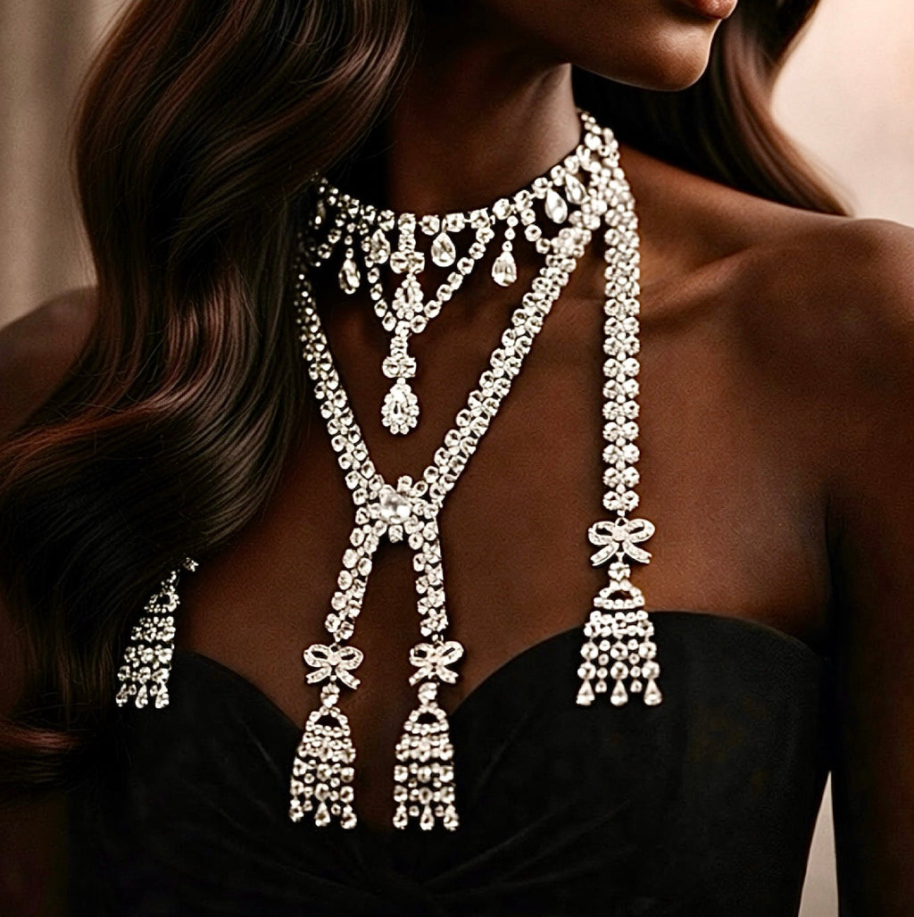 Elegant diamond marie antionette necklace with bows on a model against a neutral background