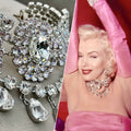 marilyn monroe staged jewels necklace showcased against marilyn monroe wearing real necklace